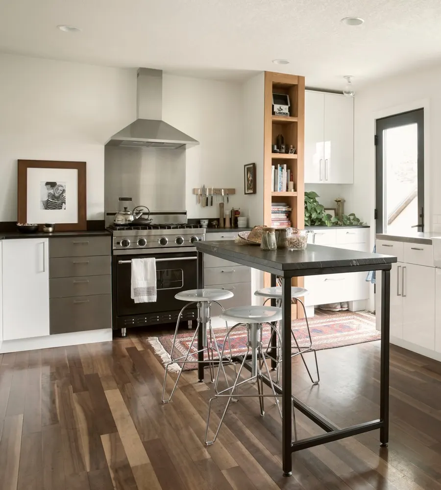 Open kitchen with range hood and wood floors