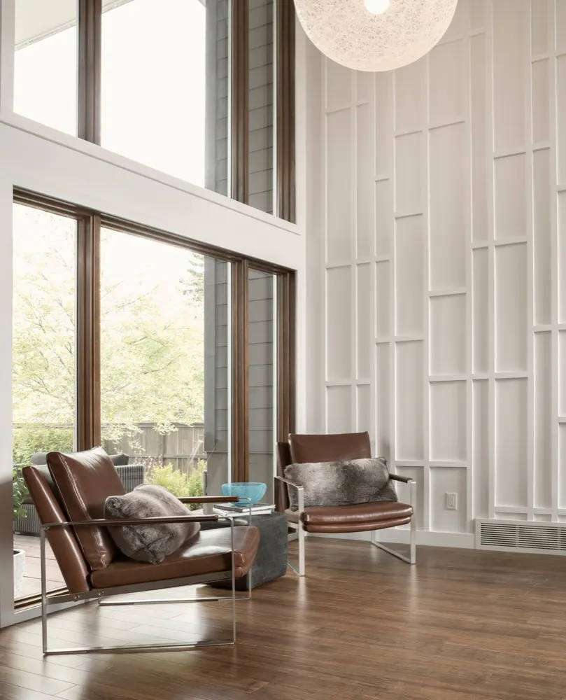 Two-story living room with tall windows